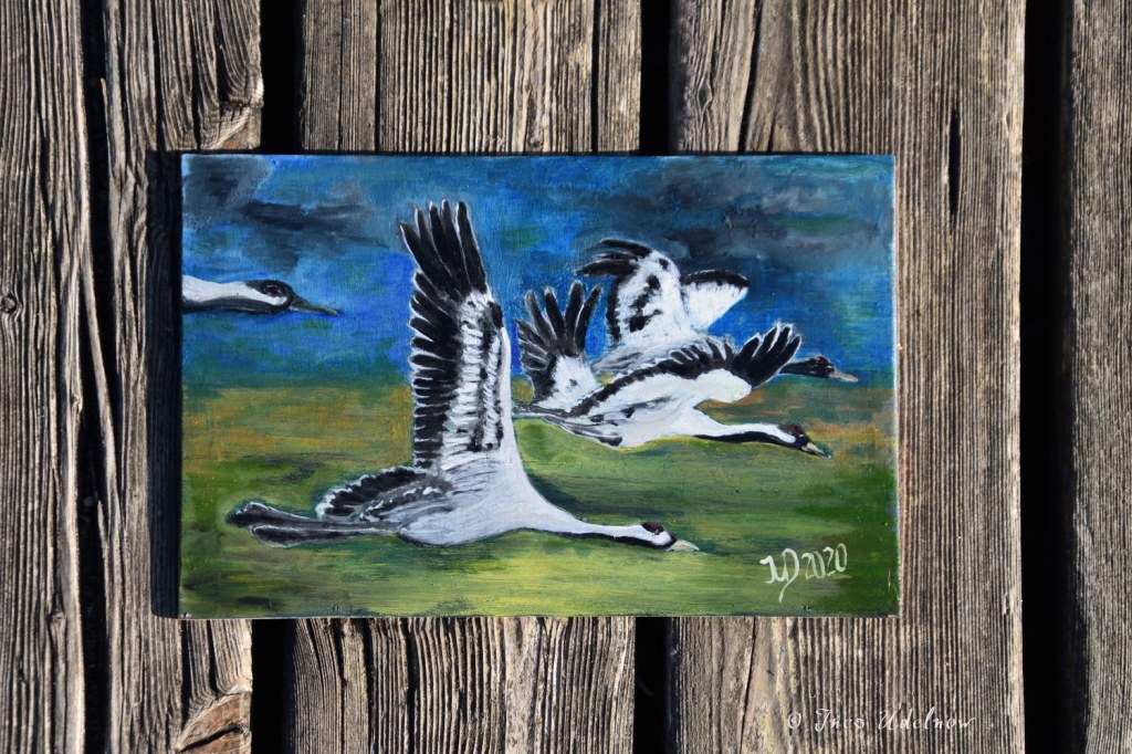 Kunst auf Zigarrenkistenbrettchen. Kraniche